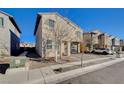 Two-story house with a two-car garage and side yard at 5694 Colbert St, North Las Vegas, NV 89081