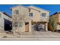 Two-story house with a two-car garage and front yard at 5694 Colbert St, North Las Vegas, NV 89081