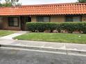 Tan house with tile roof and landscaped front yard at 6681 Bubbling Brook Dr # A, Las Vegas, NV 89107