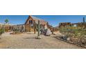 Spacious front yard showcasing desert landscaping and charming details at 919 Havre Ave, Henderson, NV 89015