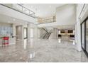 Spacious living area with high ceilings, marble floors, and open floor plan at 101 San Martino Pl, Henderson, NV 89011