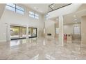 Open living space featuring marble floors, high ceilings and access to backyard at 101 San Martino Pl, Henderson, NV 89011