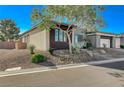 Single-story home with attractive landscaping and a two-car garage at 4829 E Beacon Ridge Dr, Pahrump, NV 89061
