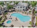 Aerial view of community pool and spa with surrounding landscaping at 5710 E Tropicana Ave # 2017, Las Vegas, NV 89122