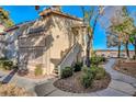Exterior view showing building entrance and landscaping at 5710 E Tropicana Ave # 2017, Las Vegas, NV 89122