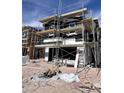 Modern two-story home under construction with scaffolding against a blue sky at 9132 Vesey Ave, Las Vegas, NV 89148