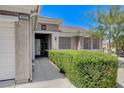 Front entry with well-maintained landscaping and walkway at 2600 Memphis Ave, Henderson, NV 89052