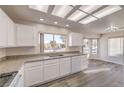 Bright kitchen with white cabinets, granite countertops, and modern appliances at 2816 Bent Tree Ct, Las Vegas, NV 89134