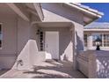 White front door entry with sidelights and light fixture at 5271 Deanna St, Pahrump, NV 89048