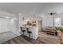 Modern kitchen featuring white cabinets and a breakfast bar at 929 Rockview Dr # 202, Las Vegas, NV 89128