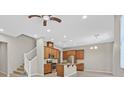 Modern kitchen with island, stainless steel appliances, and wood cabinets at 10375 Pescado Ln, Las Vegas, NV 89135
