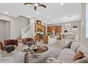 This living room boasts an open floor plan, modern decor, and a seamless transition to the gourmet kitchen at 10375 Pescado Ln, Las Vegas, NV 89135