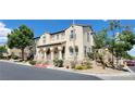 Beautiful two-story house with landscaping and a paved driveway at 12064 Avery Meadows Ave, Las Vegas, NV 89138