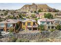 Luxury home with hilltop views and a stone wall at 16 Cerchio Basso, Henderson, NV 89011