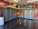 Well-organized garage with cabinets and overhead storage for efficient space utilization at 181 Elexese Ct, Las Vegas, NV 89183