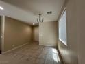 Spacious living room featuring tile flooring and ample natural light at 181 Elexese Ct, Las Vegas, NV 89183