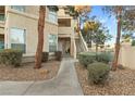 Residential building exterior with walkway and landscaping at 2251 Wigwam Pkwy # 211, Henderson, NV 89074