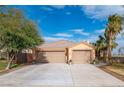 Two-story house with a two-car garage and driveway at 2520 Links Dr, Laughlin, NV 89029
