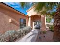 Front porch entryway with seating and landscaping at 2520 Links Dr, Laughlin, NV 89029