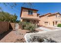 Charming two-story home with stucco exterior, red tile roof, and an attached one car garage at 3396 Villa Fiori Ave, Las Vegas, NV 89141