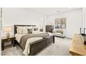 Spacious primary bedroom with a large bed and ensuite bath at 52 Reverie Heights Ave, Henderson, NV 89011