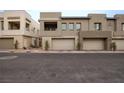Three-unit townhome building with attached garages at 600 N Carriage Hill Dr # 1108, Las Vegas, NV 89138
