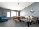 Open living area with large windows and comfortable seating at 207 Charter Oak St, Henderson, NV 89074
