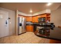 Modern condo kitchen, wood cabinets, granite counters at 211 E Flamingo Rd # 414, Las Vegas, NV 89169