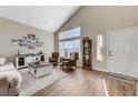 Living room with hardwood floors, high ceilings, and a grandfather clock at 2572 Hidden Forest Cir, Henderson, NV 89074