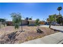 Ranch style home with front yard and driveway at 2994 Burnham Ave, Las Vegas, NV 89169