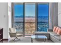 Relaxing living room with a sectional sofa and breathtaking views at 4381 W Flamingo Rd # 3819, Las Vegas, NV 89103