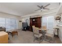 Open living room boasts ample natural light, a ceiling fan, a dining area, and an entertainment center at 6701 Dorita Ave # 201, Las Vegas, NV 89108