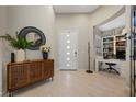 Bright entryway with built-in shelving and wood-look flooring at 6833 Desert Crimson St, Las Vegas, NV 89148