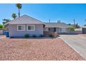 Ranch style home with gray exterior and rock landscaping at 821 Mar Jay Ct, Las Vegas, NV 89107