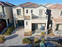Two-story house with balcony, porch, and attached garage, aerial view at 9068 Alluring Ave, Las Vegas, NV 89149