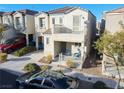 Two-story house with balcony, porch, and attached garage, aerial view at 9068 Alluring Ave, Las Vegas, NV 89149