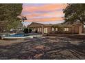 Backyard oasis with a sparkling pool and a stone pathway at 1520 Bridle Dr, Henderson, NV 89002