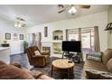 Living room featuring a fireplace, flat-screen TV, and comfortable seating at 2594 Florida Keys Dr, Las Vegas, NV 89156