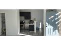 Modern kitchen with dark cabinets and stainless steel appliances at 3318 N Decatur Blvd # 1073, Las Vegas, NV 89130