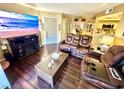Bright living room with hardwood floors, large TV, and comfortable seating at 3550 Bay Sands Dr # 1070, Laughlin, NV 89029