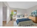 Spacious bedroom with a plush bed and wood dresser at 4380 Sandy River Dr # 36, Las Vegas, NV 89103