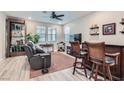 Relaxing living room with a home bar and comfortable seating at 495 Granite Arch St, Las Vegas, NV 89138