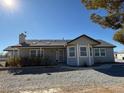 Rear view of the house showcasing a large window at 5061 E Kellogg Rd, Pahrump, NV 89061