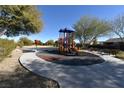 Community playground with playset and benches at 6119 Forest Pony Ave, Las Vegas, NV 89122