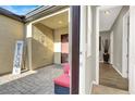 Private courtyard entrance with a seating area, offering a tranquil entryway to the home at 7036 Winstar St # A, Las Vegas, NV 89131