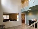 Two story entryway with a view into Gathering room and kitchen at 764 Crest Valley Pl, Henderson, NV 89011