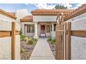 Inviting front entry with walkway and wrought-iron gate at 9321 January Dr, Las Vegas, NV 89134