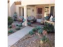 Charming front porch with seating area and well-maintained landscaping at 9321 January Dr, Las Vegas, NV 89134