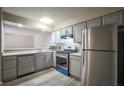 Modern kitchen with stainless steel appliances and wood-look flooring at 4348 Tara Ave # 2, Las Vegas, NV 89102
