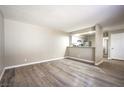 Spacious living room with wood-look floors and kitchen views at 4348 Tara Ave # 2, Las Vegas, NV 89102